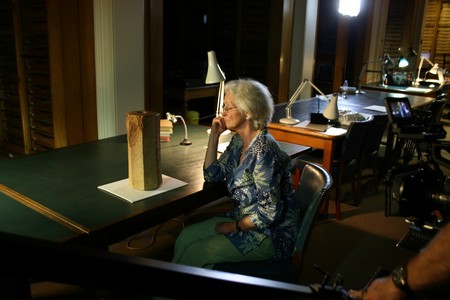 Stephanie Dalley intently examines Sennacherib's Prism at the British Museum