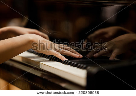 stock-photo-woman-s-hands-on-the-keyboard-of-the-piano-closeup-220898938