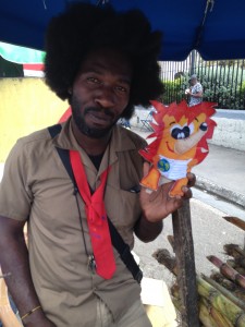 Son nouveau camarade de la Jamaïque, un vendeur de cannes à sucre déguisé en écolier!